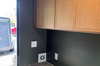 Inspiration for a small modern built-in desk vinyl floor and beige floor home office remodel in San Diego with green walls