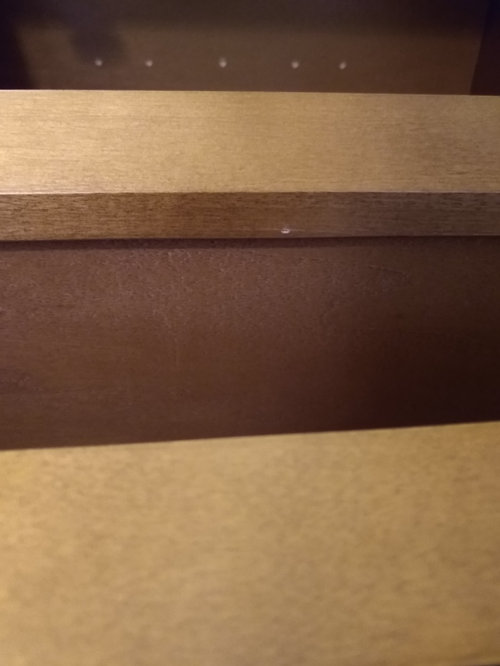 Attaching face frame of diagonal corner cabinet to straight cabinet ...