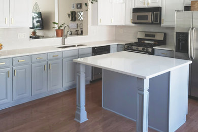 This is an example of a mid-sized l-shaped eat-in kitchen in Atlanta with quartzite benchtops, beige splashback, porcelain splashback, with island and white benchtop.