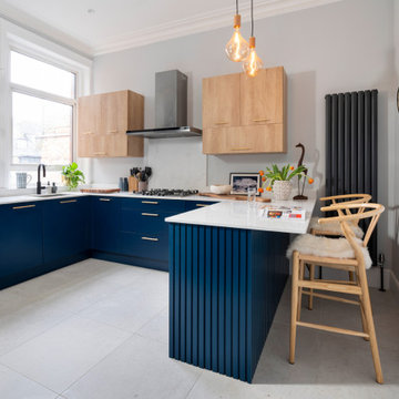 Fresh, contemporary and colourful renovation including blue bespoke kitchen and