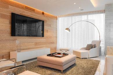 Example of a trendy family room design in Miami
