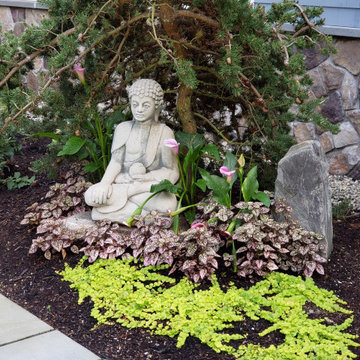 An extensive landscape project with stonewalls, patio, dry river bed & more