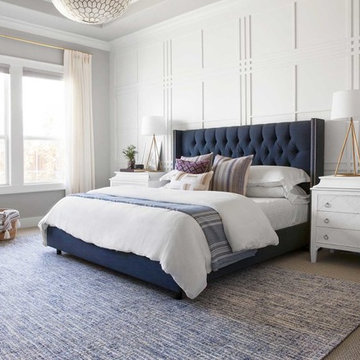 Light-Filled Master Bedroom with Custom Panel Wall and Upholstered Bed