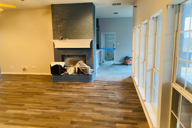 Example of a large open concept family room design in Dallas