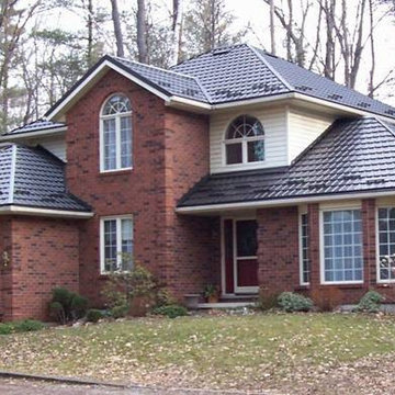 Houses with Hy-Grade's permanent steel roofing "cure"
