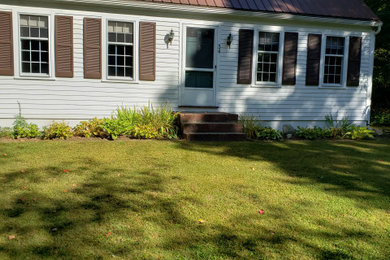Inspiration for a mid-sized timeless white two-story wood house exterior remodel in Boston