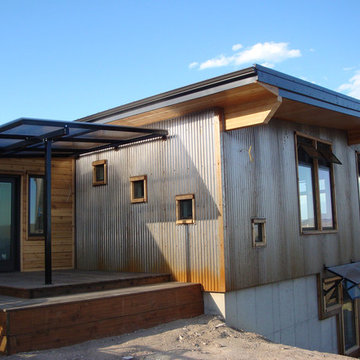 Crimson Bluffs Home- Custom Designed & Fabricated Awnings and Railing