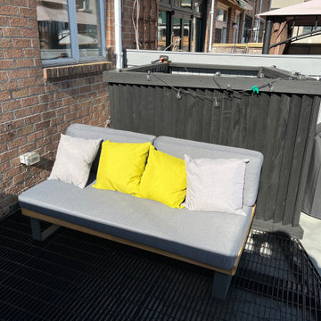Paved patio with metal grating garden