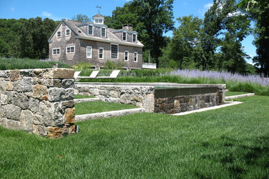 Photo of a huge traditional backyard landscaping in Boston.