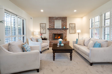 Small transitional formal and enclosed carpeted and beige floor living room photo in Los Angeles with white walls, a standard fireplace, a brick fireplace and no tv