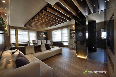 Esempio di un soggiorno design di medie dimensioni con pavimento in legno massello medio