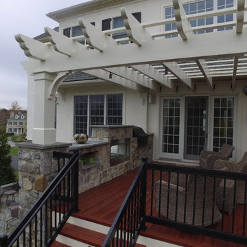 Zuri Deck with Cedar Pergola and Stone Fireplace with Grill