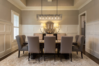 Enclosed dining room - mid-sized transitional dark wood floor and brown floor enclosed dining room idea in Atlanta with brown walls