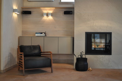 Inspiration for a medium sized contemporary mezzanine living room in Other with a home bar, beige walls, slate flooring, a standard fireplace, a stone fireplace surround and no tv.