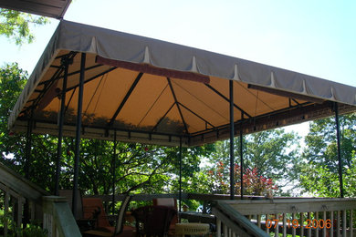 Patio - large transitional backyard patio idea in Ottawa with a gazebo