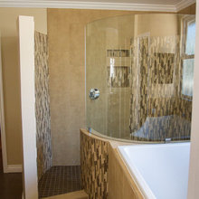 Curved glass shower enclosure