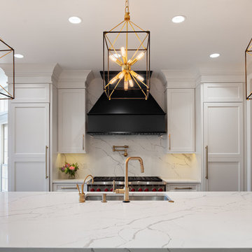 Back decorative hood and ceiling height white cabinets