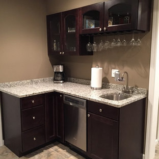 Photo of a small modern fully buried basement in Other with beige walls.