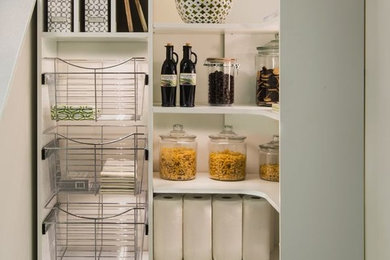 Photo of a small transitional l-shaped kitchen pantry in Philadelphia with white cabinets and open cabinets.