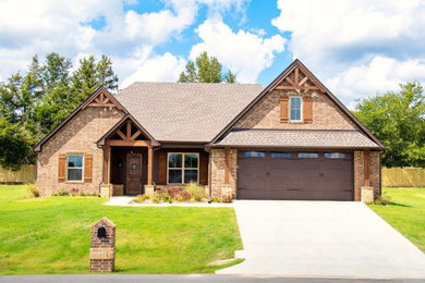 Inspiration for a mid-sized rustic brown one-story brick house exterior remodel in Dallas with a shingle roof
