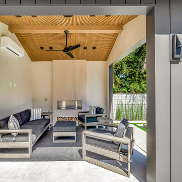 Covered Outdoor Lounge with Wood Slat Ceiling & Pool View