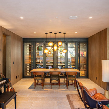 Modern Bronze Steel Wine Wall and Liquor Display in Luxury Custom Home Basement