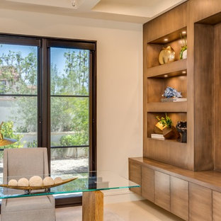 Photo of a medium sized modern study in Orange County with white walls, limestone flooring, no fireplace and a freestanding desk.