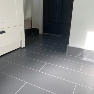 Plank tile Flooring and Penny tile Backsplash