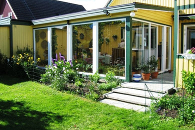 Photo of a transitional sunroom in Malmo.