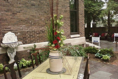 Inspiration for a small rustic backyard stone patio remodel in Indianapolis with no cover