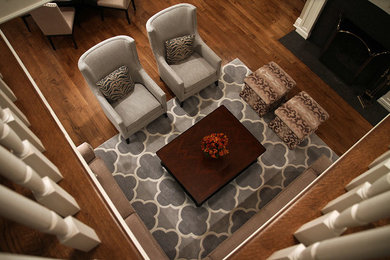 Living room - mid-sized contemporary formal and enclosed medium tone wood floor living room idea in Other with beige walls, a standard fireplace and no tv