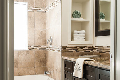 Large elegant master beige tile and porcelain tile terra-cotta tile drop-in bathtub photo in Other with flat-panel cabinets, dark wood cabinets, white walls, a console sink and granite countertops
