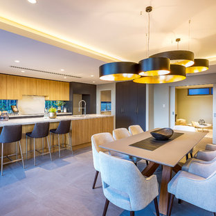 Inspiration for a mid-sized contemporary kitchen/dining combo in Perth with grey walls and grey floor.