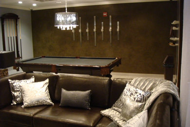 Example of a large eclectic enclosed game room design in New York with multicolored walls, a media wall and no fireplace