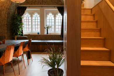 This is an example of an eclectic dining room in London.