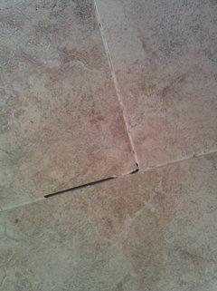 Touch-up unsanded grout shrinkage cracks with sanded grout?