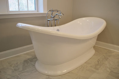 Mid-sized master bathroom in Boston with a freestanding tub.