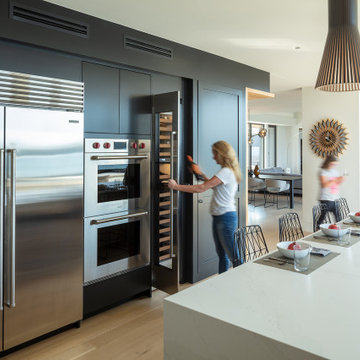 Modern Kitchen with Waterfall Edge Island