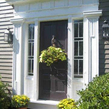 Greek Revivial entry with Large pilaster, architrave, cornice door frame with tr