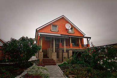 Example of a classic exterior home design in Other