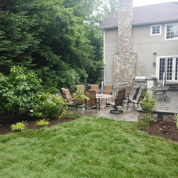 Patio with stone wall and fire pit