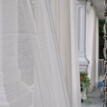 Create a stylish front porch with outdoor curtains