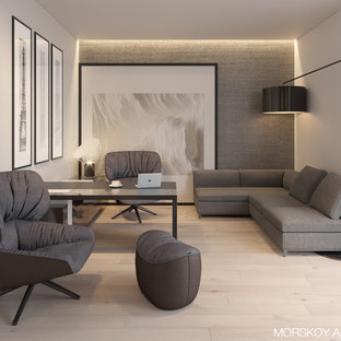 Inspiration for a small modern study in Other with beige walls, light hardwood flooring, no fireplace, a freestanding desk and beige floors.