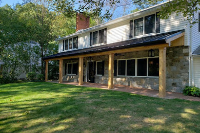 Large mountain style front porch idea in Cleveland