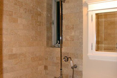 Bathroom - multicolored tile and stone tile bathroom idea in Denver with a drop-in sink, flat-panel cabinets, dark wood cabinets, solid surface countertops and beige walls