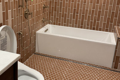 Example of a large eclectic master brown tile and ceramic tile ceramic tile, multicolored floor and single-sink shower bench design in Seattle with brown cabinets, a hot tub, a one-piece toilet, a wall-mount sink, quartzite countertops, white countertops and a built-in vanity