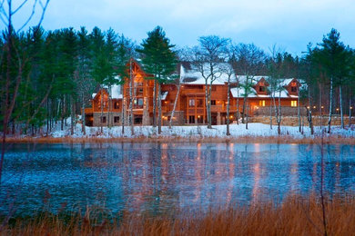 Inspiration for a rustic brown three-story wood gable roof remodel in Other