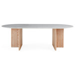 Jonathan Adler - Brussels T-Base Dining Table - A capsule shaped white Carrara marble tabletop perched on T-shaped bases made from lightly limed solid oak. Featuring clean architectural lines and ultra luxe materials, our Brussels table evokes the spirit of the ultimate Brooklyn townhouse or Tribeca loft. Modern, timeless, and totally today. Seats 6 to 8.