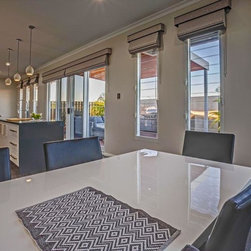 Kitchen and dining room with breezway louvre windows and view to outdoor deck - Windows
