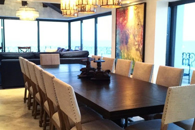 Huge transitional travertine floor enclosed dining room photo in Other with white walls